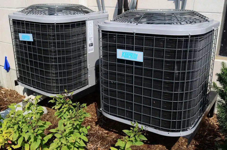 EcoFrost technician repairing a central air conditioner in Mississauga