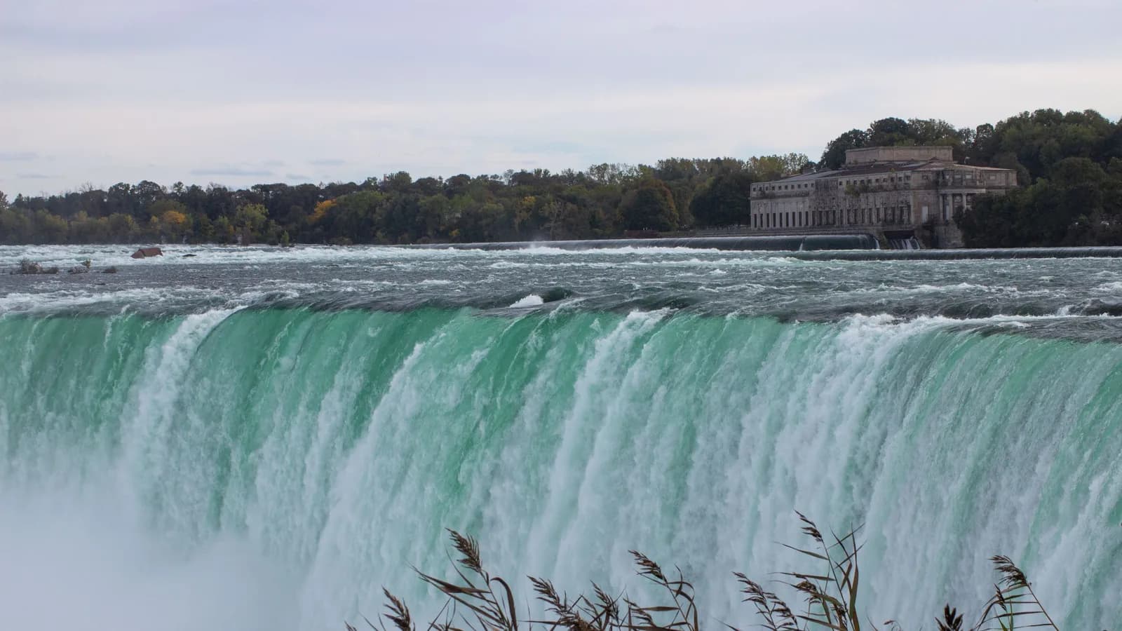 The Horseshoe Falls and the historic riverside power station at Niagara Falls, Ontario