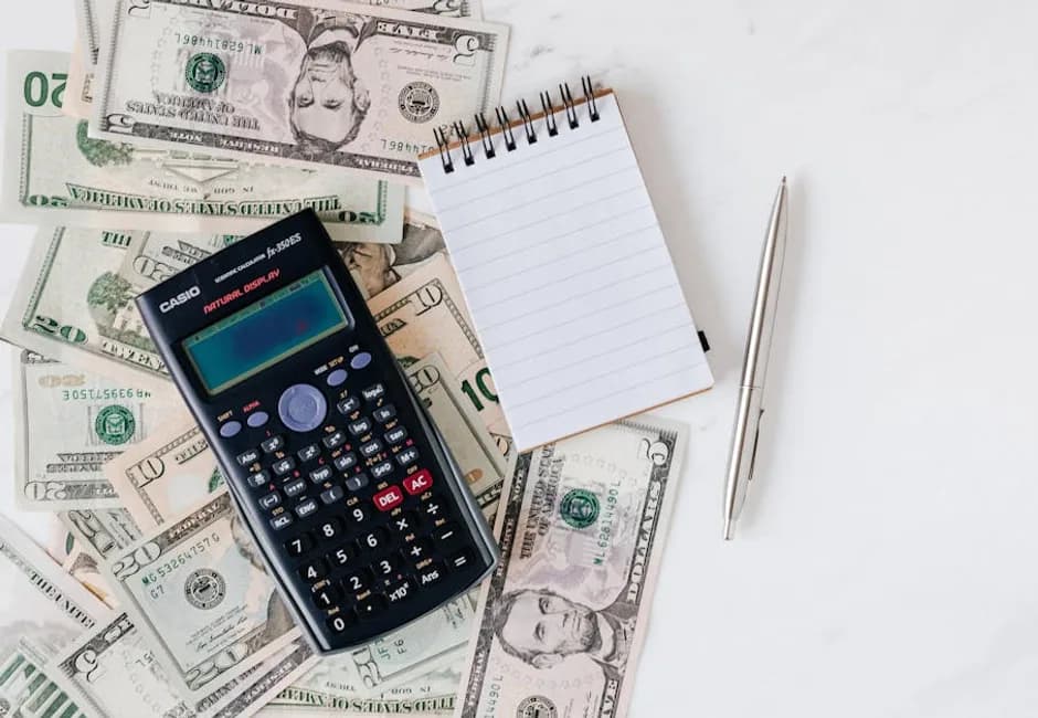 Homeowner reviewing HVAC financing options at a kitchen table with a laptop