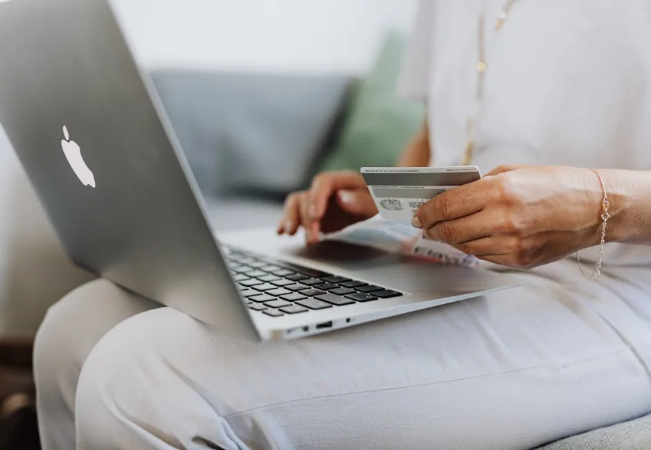 Ontario homeowner reviewing HRS heat pump rebate documents at kitchen table